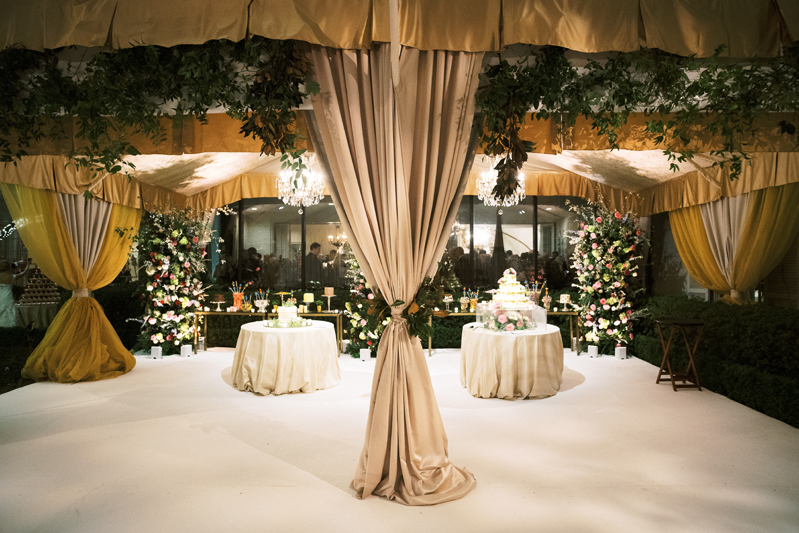 Taupe drapery at tented wedding reception in New Orleans