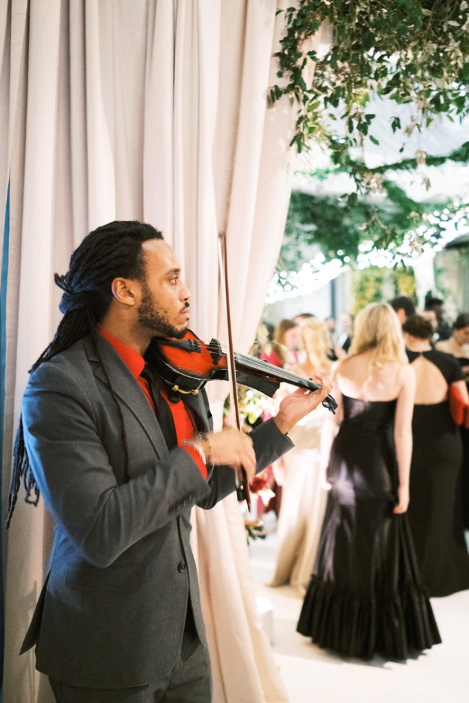 Violinist performing during cocktail hour at New Orleans wedding