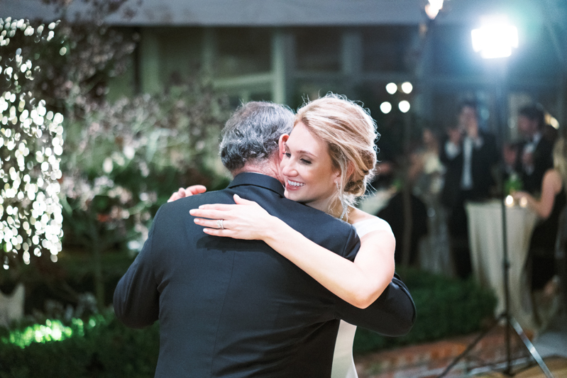Father and daughter dancing during wedding reception