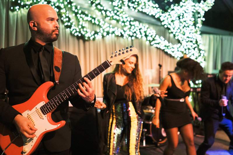 Wedding band, Powerhouse, performing at tented receptions in New Orleans.