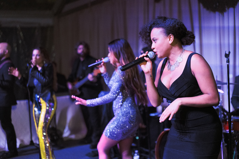 Powerhouse band singers performing at New Orleans wedding reception.