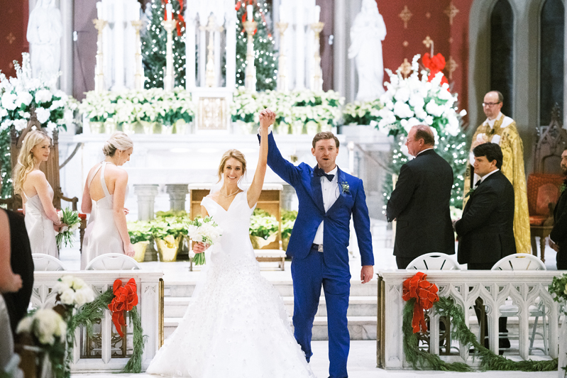 Bride and groom exiting the  Holy Name of Jesus Church in Nola after wedding