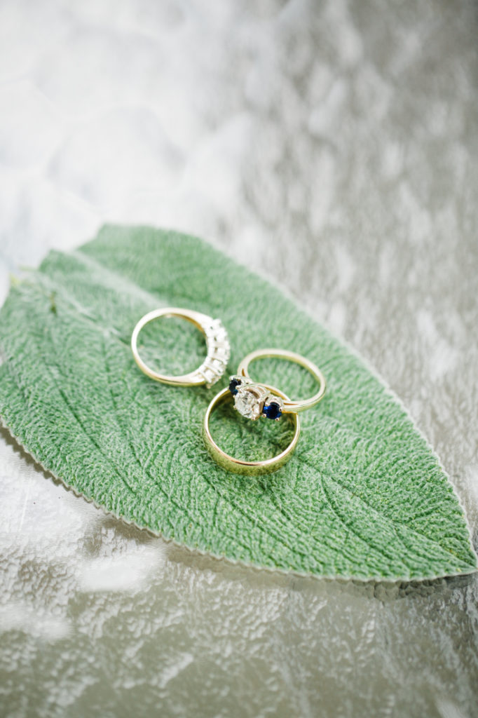 Wedding rings laying on leaf