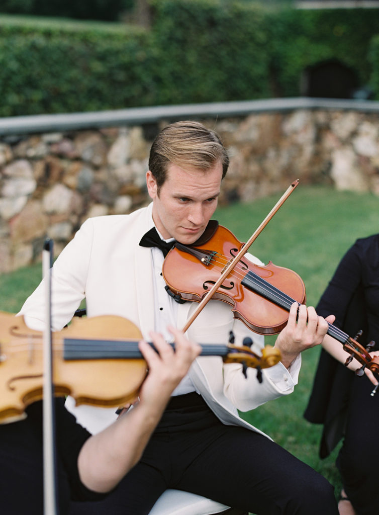 Violinist at outdoor garden wedding