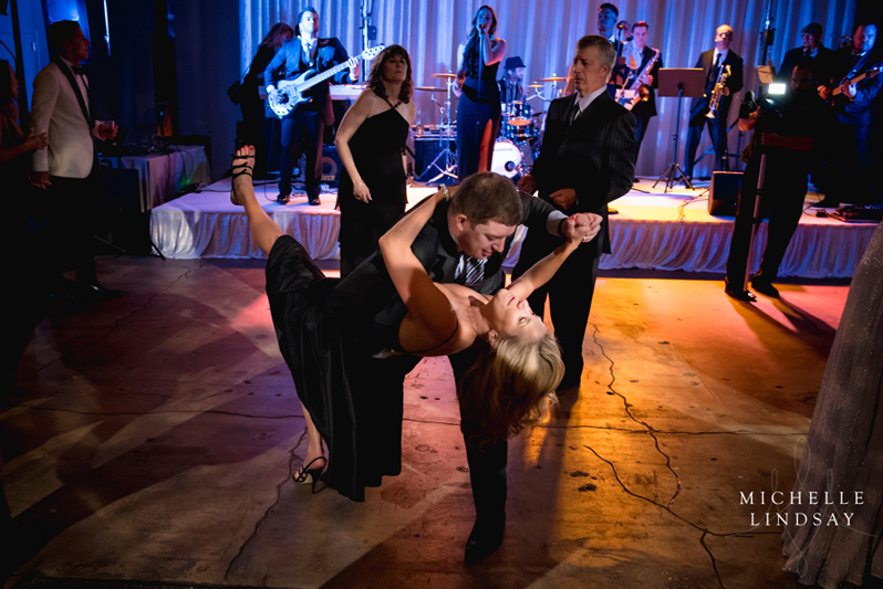 Wedding guests on dance floor dancing to Modern Luxe band.