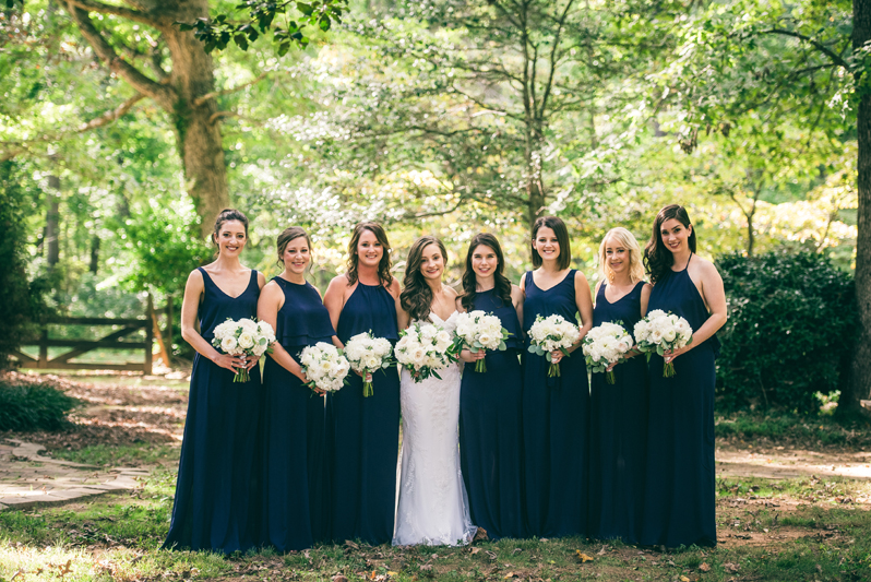 Bride and bridesmaids posing at Summerfield Farms wedding.