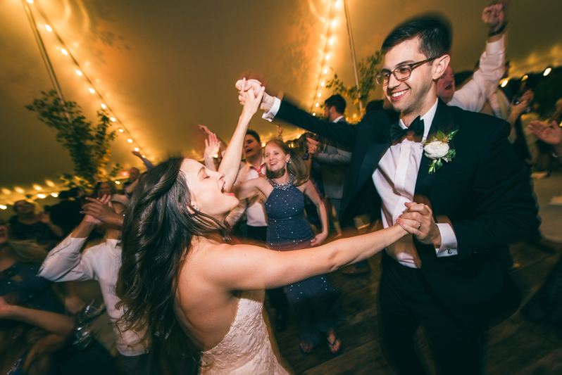 Couple happily dancing to Right to Party band during Greensboro, NC wedding reception.