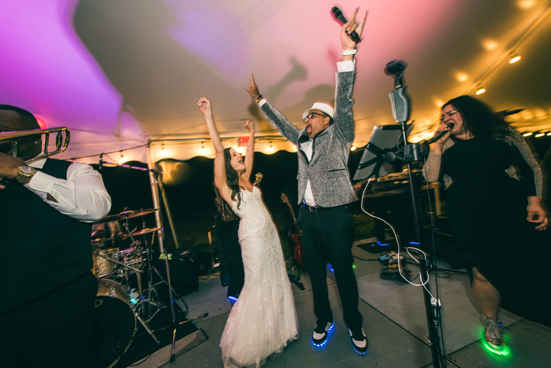 Bride on stage with Right to Party band at Summerfield Farms wedding.