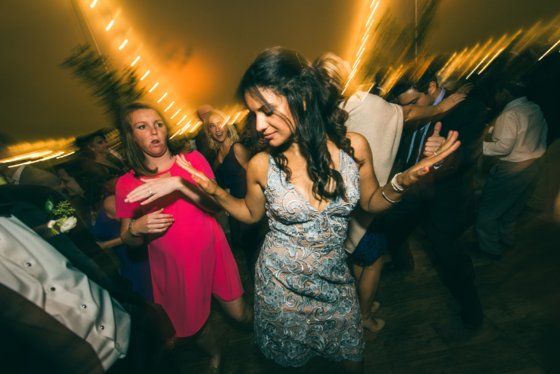 Crowded dance floor during wedding reception at Summerfield Farms.
