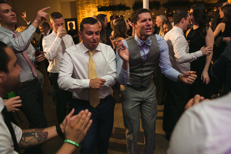 Male guests dancing during The Stave Room wedding.