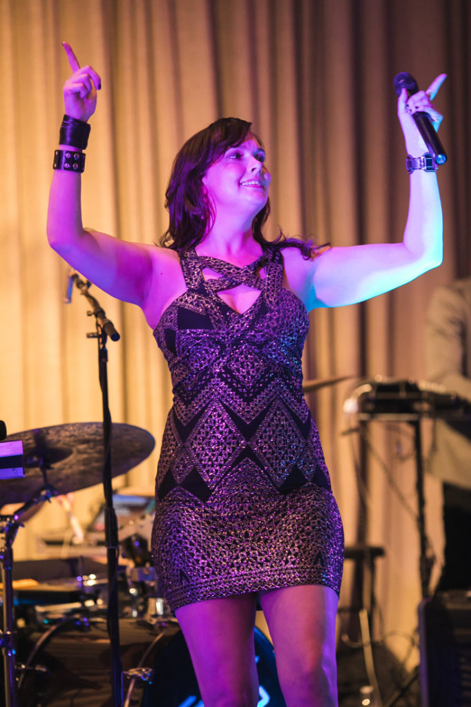 Female lead vocalist on stage during The Stave Room wedding.