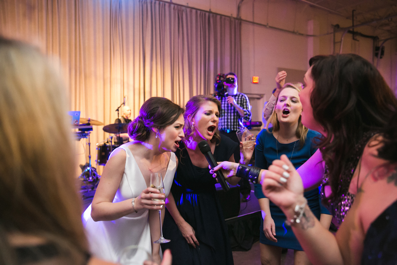 Bride and wedding guests dancing on dance floor with We Got The Beat band.