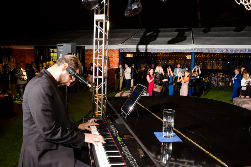 Dueling pianos performing at private corporate event.
