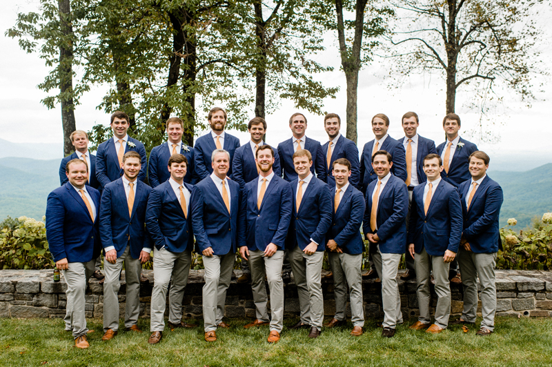 Groom and groomsmen posing at Roaring Gap Club wedding. 