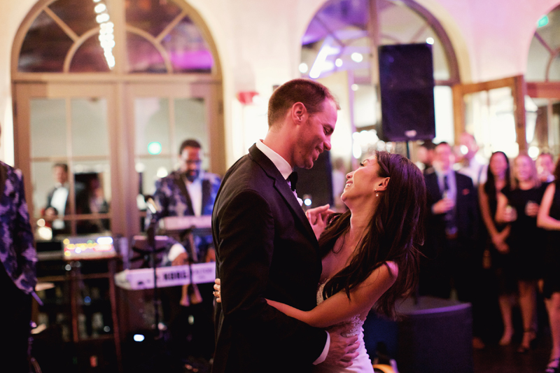 Bride and groom dancing first dance in front of Loose Chain wedding band.