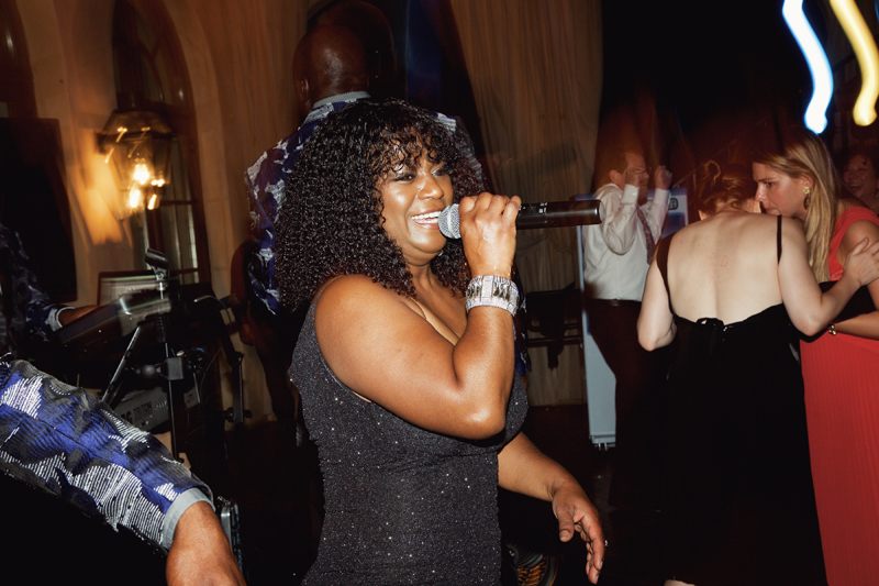 Female vocalist of Loose Chain band performing for wedding guests at Dahlonega, GA wedding.