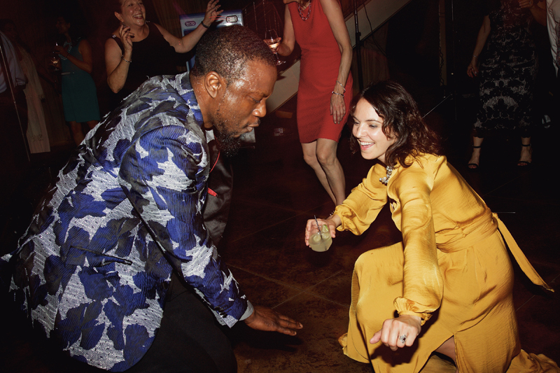 Vocalist for Loose Chain band on dance floor with guests during Montaluce wedding.