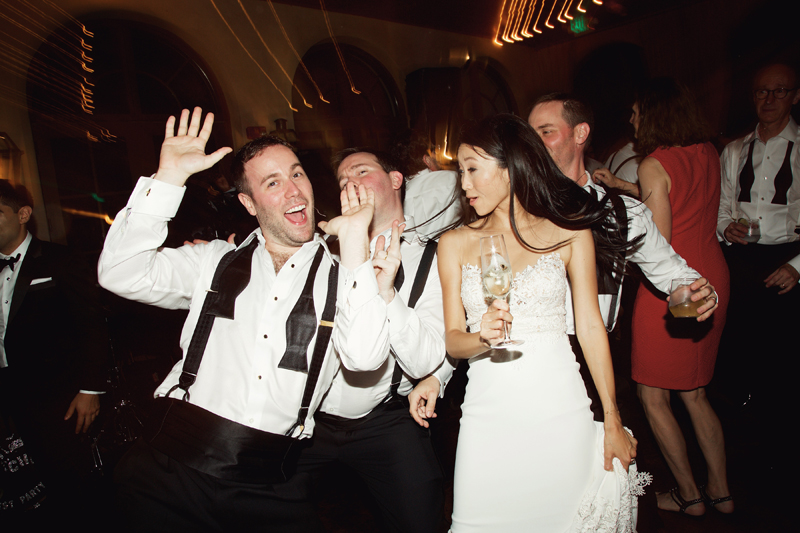 Wedding guests on crowded dance floor dancing to Loose Chain band.