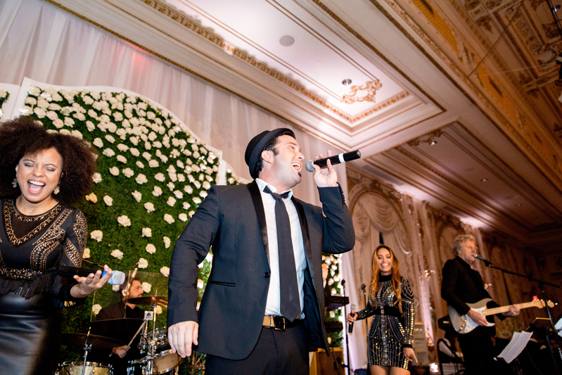Lead male vocalist of Powerhouse band during Palm Beach wedding at Mar-a-Lago resort.