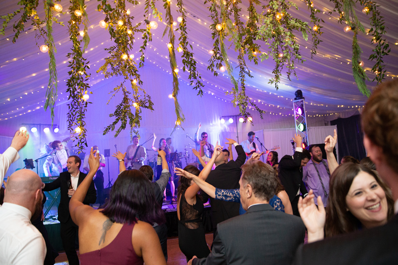 Bantum Rooster band performing in front of crowded dance floor at Biltmore wedding.