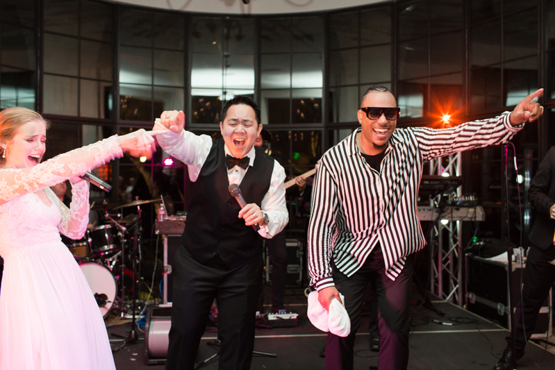 Groom on stage with The Royals band during Kiawah Island Club wedding reception.