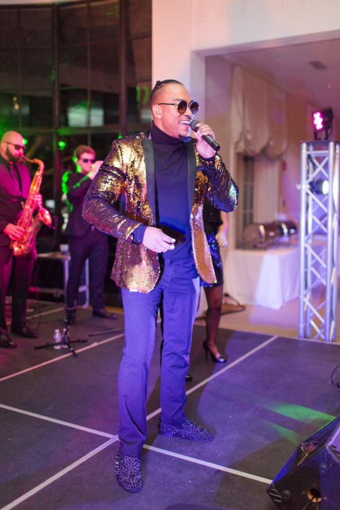 Male vocalist from The Royals band performing on stage during Kiawah Island Club wedding reception.