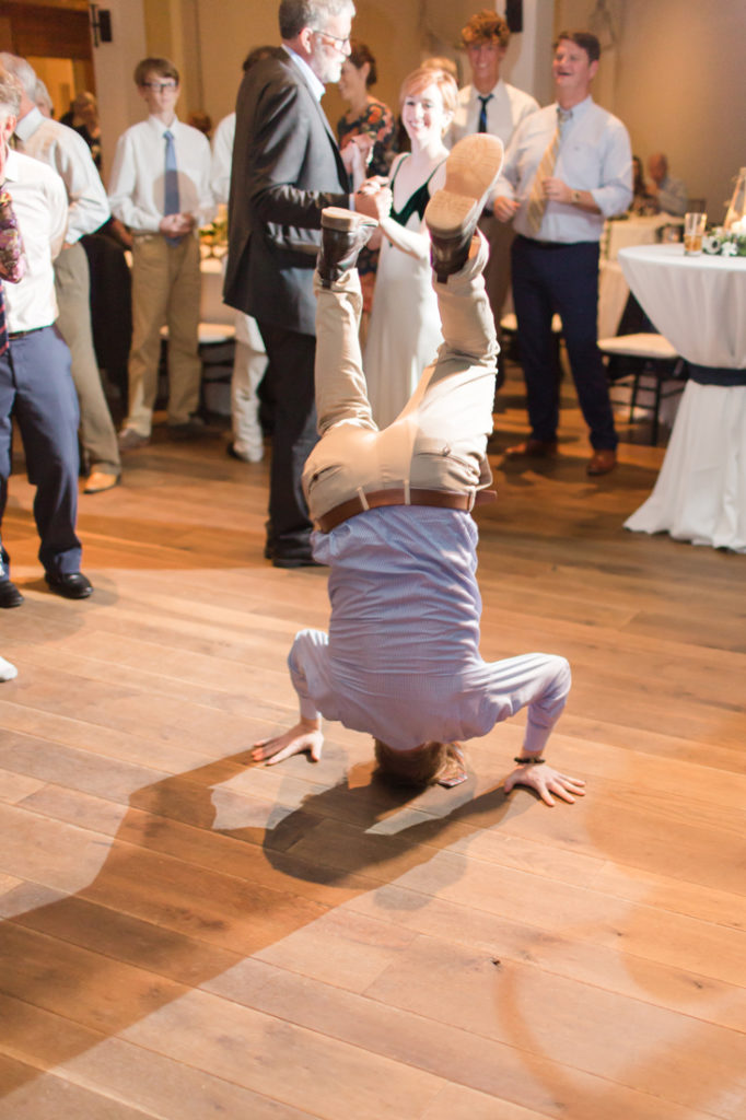 Guest breakdancing at Kiawah Island Club wedding reception.