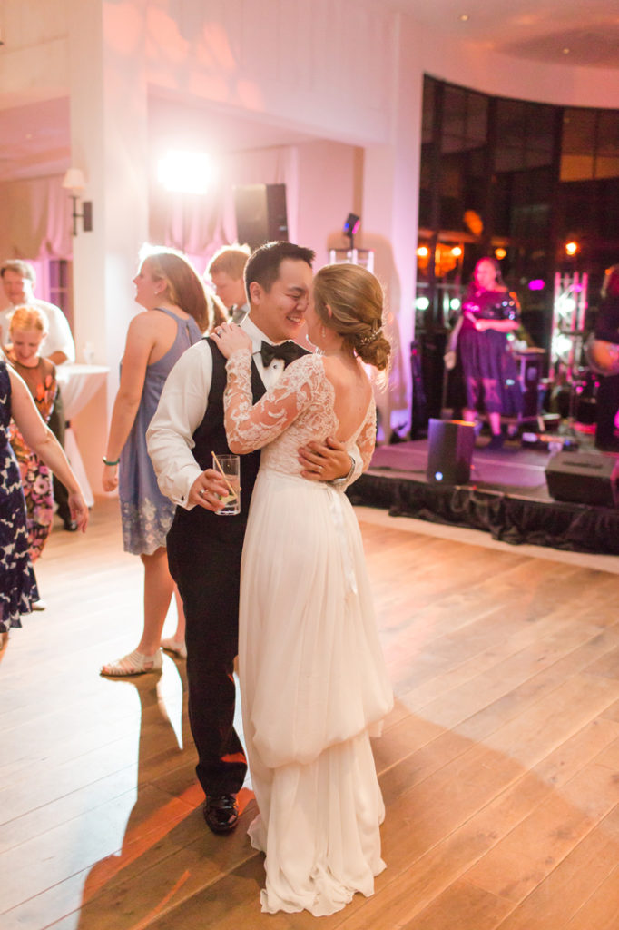 Bride and groom dancing in front of The Royals wedding band at Kiawah Island Club
