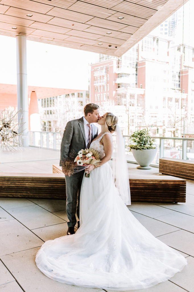 Bride and groom outside Mint Museum wedding in Charlotte, NC.