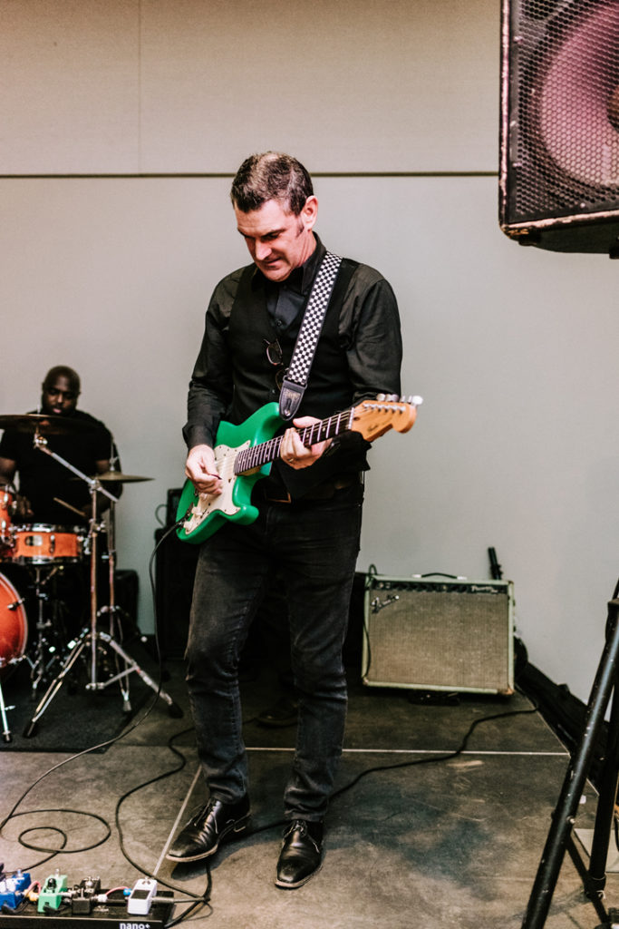 Musician from Swingin' Richards band onstage during the Big Fake Wedding