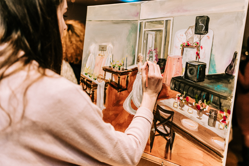 Party painter creating image during The Big Fake Wedding in Charlotte, NC.